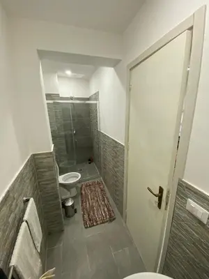 a small bathroom with a toilet and a shower at Luna di Sicilia in Palermo