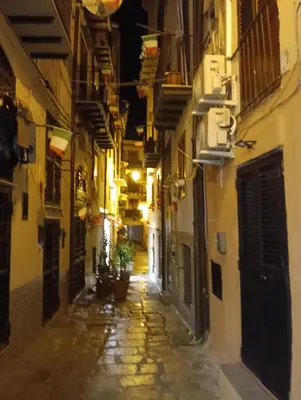 an empty alleyway at night in an old town at Luna di Sicilia in Palermo