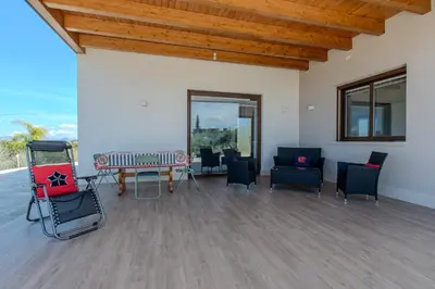 a large living room with chairs and a table at Villa Ginevra in Santa Ninfa