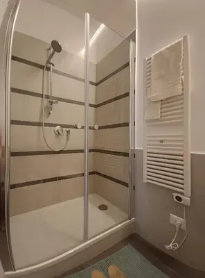 a shower with a glass door in a bathroom at Al Duca appartamento in centro in Palermo