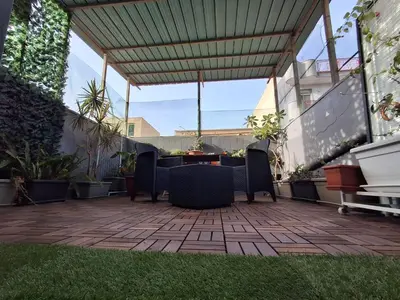 an outdoor patio with chairs and a table on a patio at La Casa di Giovy in Palermo