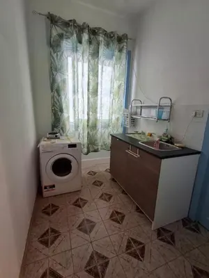 a bathroom with a sink and a washing machine at La Casa di Giovy in Palermo
