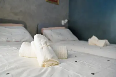 a pair of towels sitting on a bed at Modern apartment center Palermo in Palermo