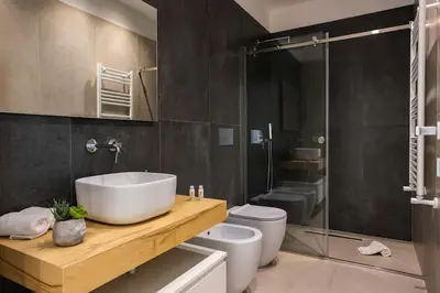 a bathroom with a sink and a toilet at Luxury Jacuzzi Villa Diana in Palermo