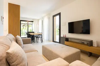 a living room with a couch and a flat screen tv at Luxury Jacuzzi Villa Atena in Palermo