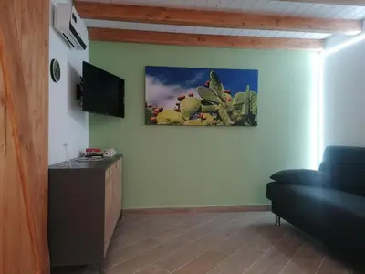 a living room with a tv and a couch at L'angolo dei sogni in Palermo