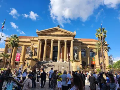 a group of people standing in front of a building at L'angolo dei sogni in Palermo