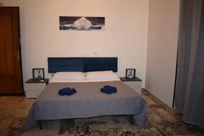 a bedroom with a bed with two hats on it at Goethe's Sicily trip - Palermo in Palermo