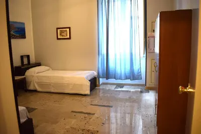 a bedroom with a bed and a window at Goethe's Sicily trip - Palermo in Palermo
