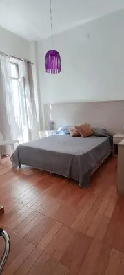 a bedroom with a large bed in a room at Il Quadrifoglio Room& Suite in Palermo