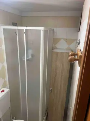 a small bathroom with a shower and a toilet at Fra centro & mare in Palermo