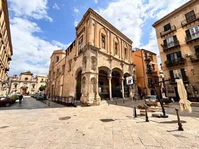 an old stone building on a city street at Casa Cassarelli in Centro in Palermo