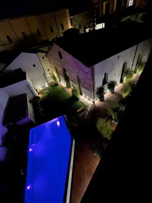 an aerial view of a house at night with lights at Spasimo Hôtellerie in Palermo
