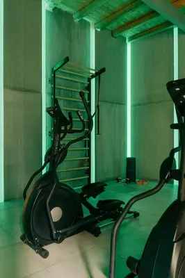 a room with a gym with exercise bikes in it at Spasimo Hôtellerie in Palermo