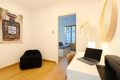 a room with a desk with a laptop computer on it at La Terrazza del Garraffello in Palermo