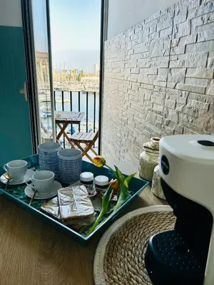 a tray of food on a table in a room at CalaMia in Palermo
