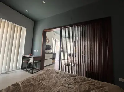 a bedroom with a bed and a desk in a room at Cantù Home in Misilmeri