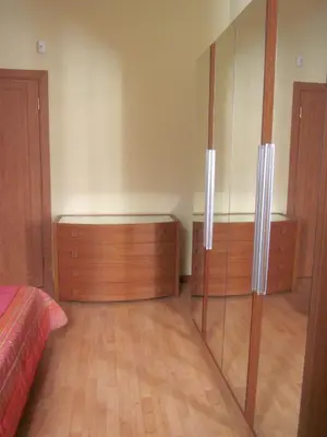 a bedroom with wooden cabinets and a bed at Panormus Home&Apartaments in Palermo