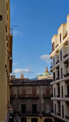 a view of the roofs of two buildings at Panormus Home&Apartaments in Palermo