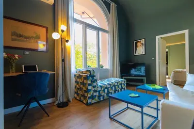 a living room with a couch and a table at Green Luxury Apartment in Palermo
