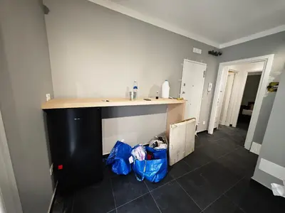 a kitchen with a counter and a blue bag on the floor at luccina ai normanni in Palermo