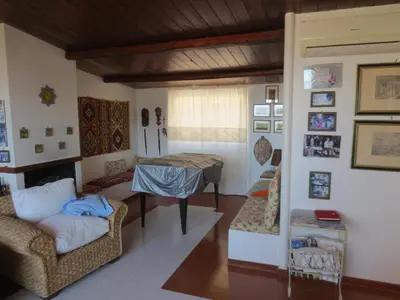 a living room with a table and a couch at Casa Allegra Mondello in Palermo