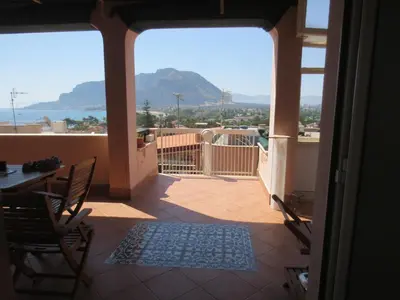 a view of a balcony with a table and chairs at Casa Allegra Mondello in Palermo