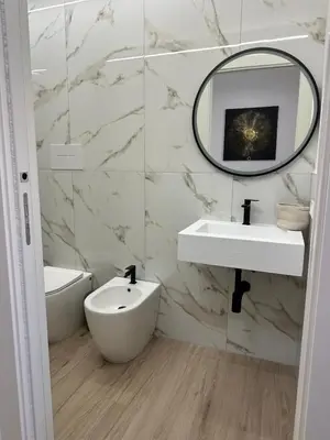 a bathroom with a sink and a mirror at Palermo Mia in Palermo