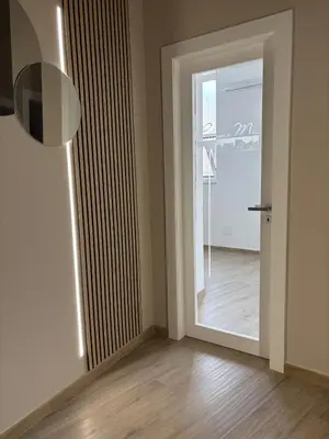 an empty room with a door and a hallway at Palermo Mia in Palermo