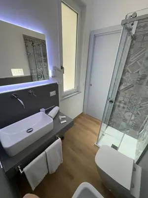 a bathroom with a sink and a shower at B&B Central Station in Palermo