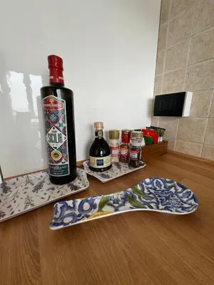 a bottle of alcohol sitting on top of a counter with a skateboard at La Bella Vista in Palermo