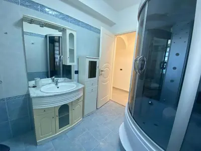 a bathroom with a sink and a shower and a mirror at La Bella Vista in Palermo