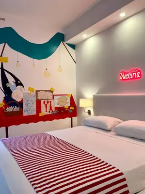 a bedroom with a bed with a neon sign on the wall at 3Markets Rooms in Palermo