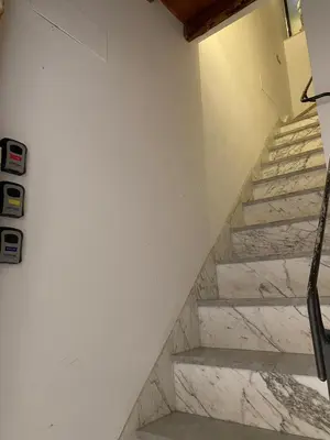 a set of stairs in a room with marble at 3Markets Rooms in Palermo