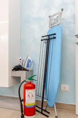 a fire extinguisher and a surfboard in a room at Stella del Sud in Palermo