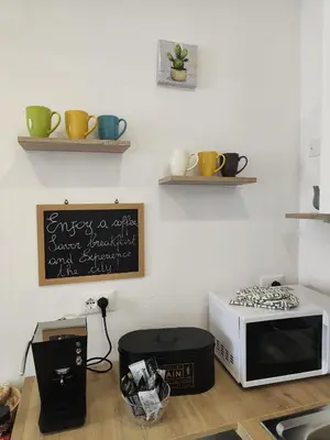 a kitchen with a microwave and a counter top at PaMa House comfort e relax a due passi dal centro in Palermo