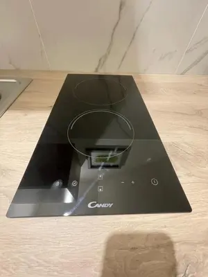 a black router sitting on a wooden table at Calderai Suite centro storico Palermo in Palermo