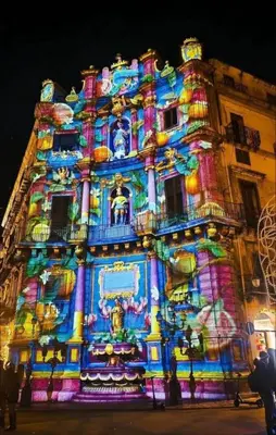 a building with a lit up facade at night at Calderai Suite centro storico Palermo in Palermo