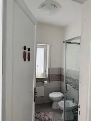a bathroom with a toilet and a sink at Casa Katarina in Calatafimi