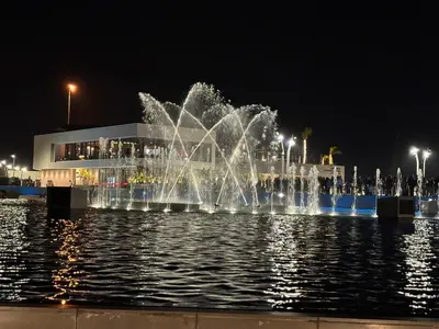 a fountain in the water in front of a building at Scilia casa vacanza in Palermo