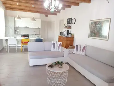 a living room with two white couches and a table at Ciuri CiuriHome in Balestrate