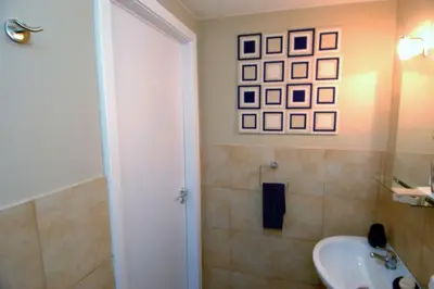 a bathroom with a sink and a toilet and a shower at Virna House a Castellammare del Golfo in Castellammare del Golfo
