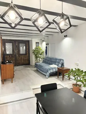 a living room with a couch and a table at Casa Pipa in Palermo