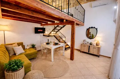 a room with a bunk bed and a ladder at Casa Meravigghia terrazzo ,giardino e Jacuzzi in Palermo
