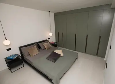 a bedroom with a bed with two pillows on it at G&M Place in Palermo