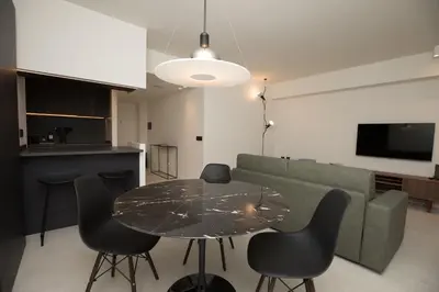 a living room with a table and a couch at G&M Place in Palermo