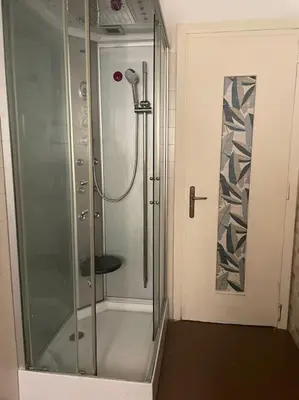 a shower with a glass door in a bathroom at Casa Visconti 170mq-centro storico in Palermo