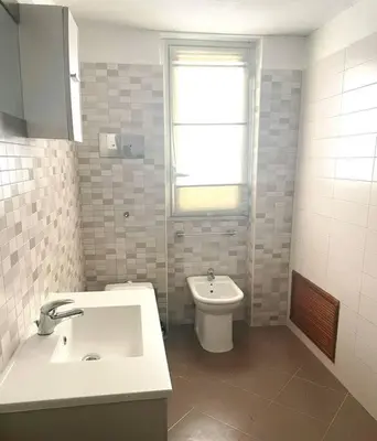 a bathroom with a sink and a toilet at Casa Visconti 170mq-centro storico in Palermo