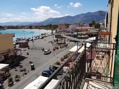 a view from a balcony of a town with a beach at Appartamento Mediterraneo Mondello in Palermo