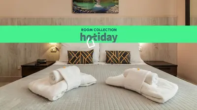 a room with a bed with towels on it at HOTIDAY Room Collection - Palermo Politeama in Palermo